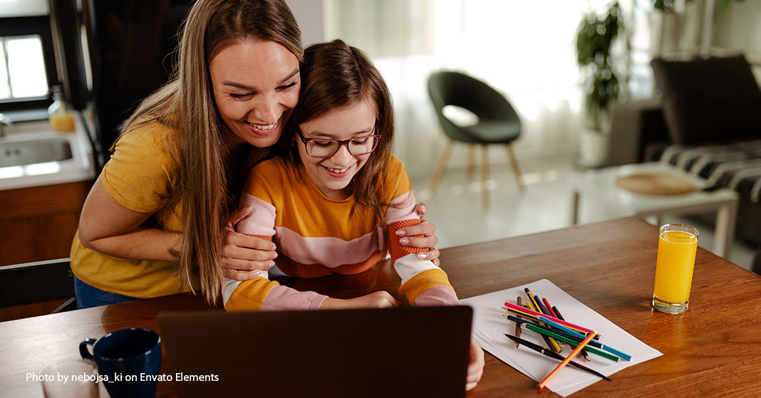 mom and child sitting at a computer