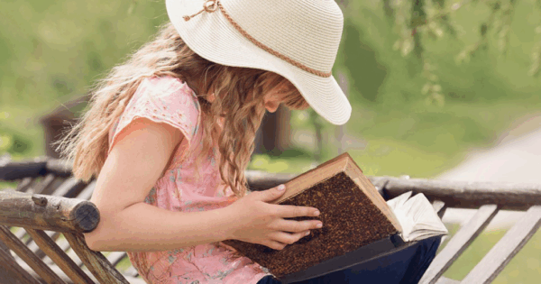 Child reading during summer